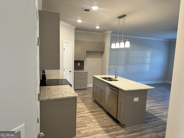 kitchen featuring gray cabinetry, sink, hanging light fixtures, stainless steel dishwasher, and a center island with sink