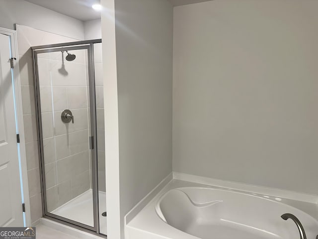 bathroom featuring plus walk in shower