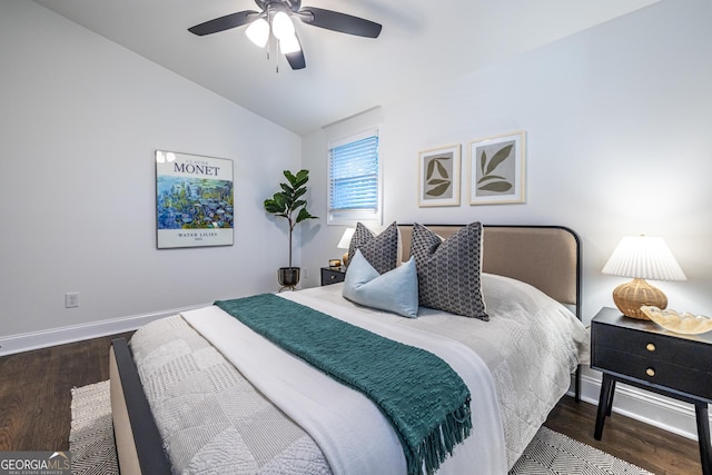 bedroom with lofted ceiling, a ceiling fan, baseboards, and wood finished floors