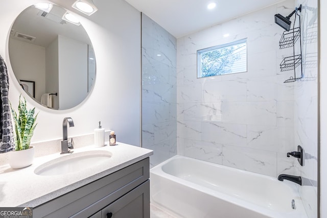 bathroom featuring vanity, shower / tub combination, and visible vents