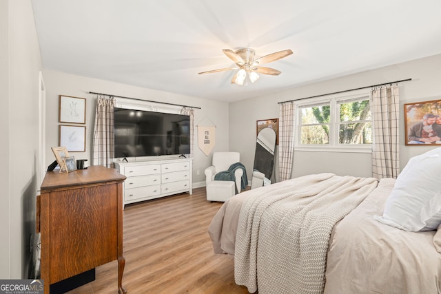 bedroom featuring ceiling fan and light hardwood / wood-style floors