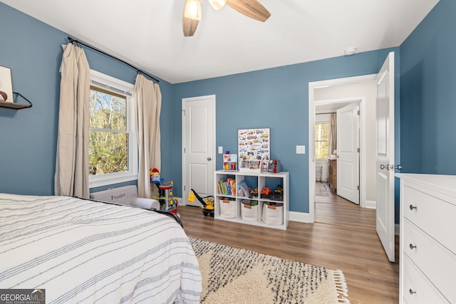 bedroom featuring ceiling fan and light hardwood / wood-style floors