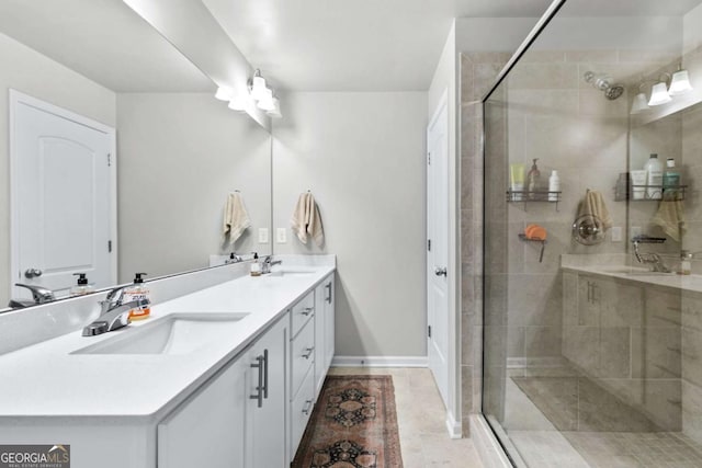 bathroom featuring tile patterned flooring, vanity, and an enclosed shower