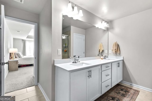 bathroom with tile patterned flooring and vanity