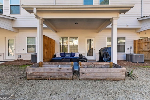 view of patio / terrace with an outdoor living space, central AC unit, and a grill