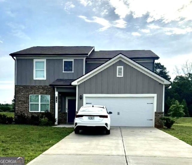 view of front of house featuring a front yard and a garage