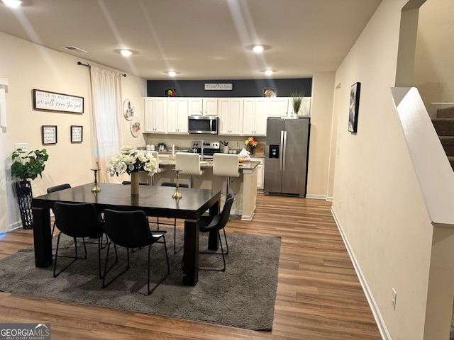 dining room featuring hardwood / wood-style flooring