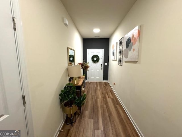 doorway featuring hardwood / wood-style flooring