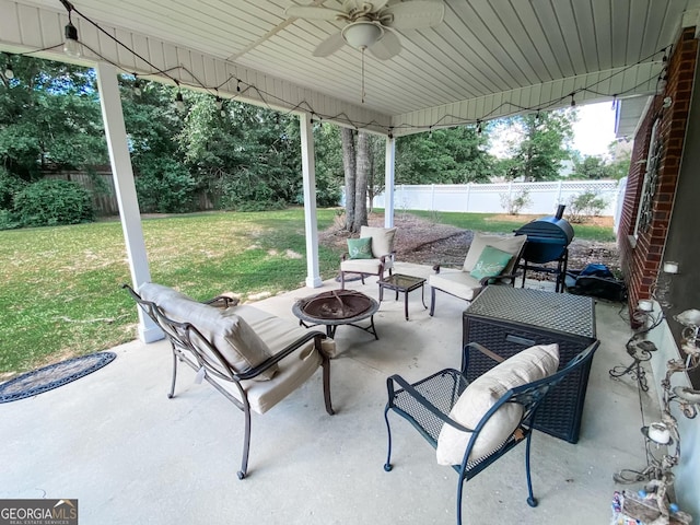 view of patio / terrace featuring a fire pit and ceiling fan