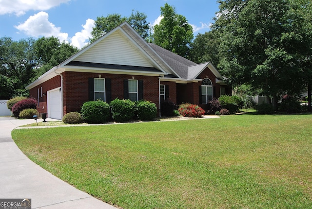 ranch-style home featuring a garage and a front lawn