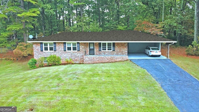 ranch-style house with a carport and a front yard