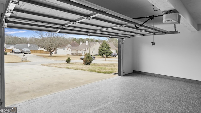 garage with a carport and a garage door opener