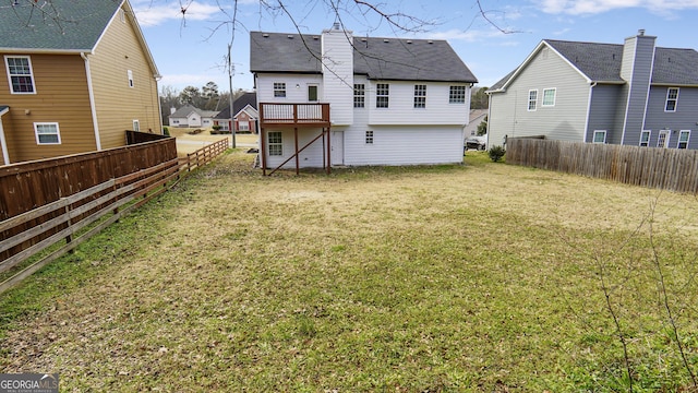 back of house featuring a lawn