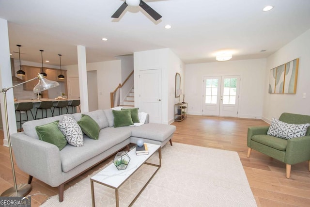 living room with ceiling fan and wood-type flooring