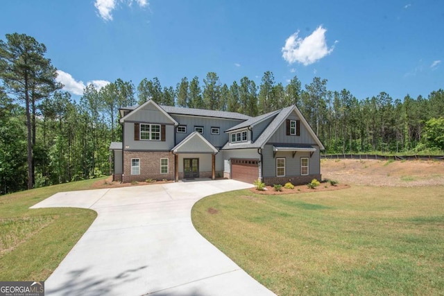 view of front facade with a garage and a front lawn