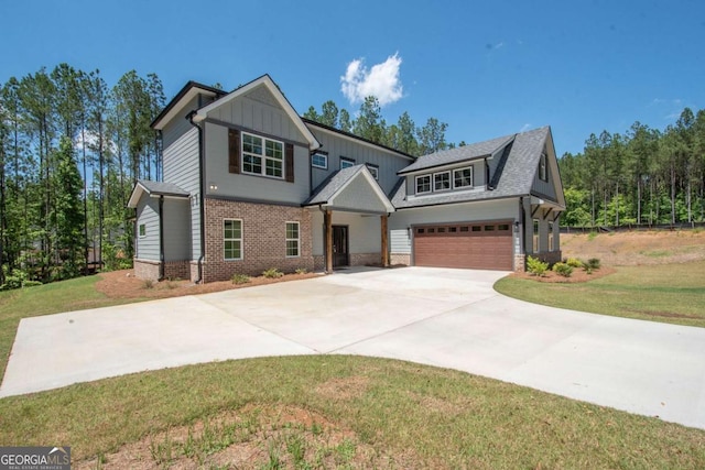 view of front facade with a garage and a front yard