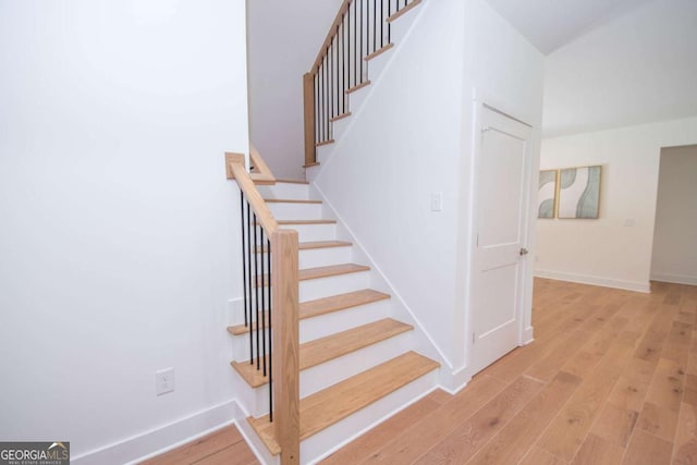 stairway featuring hardwood / wood-style floors