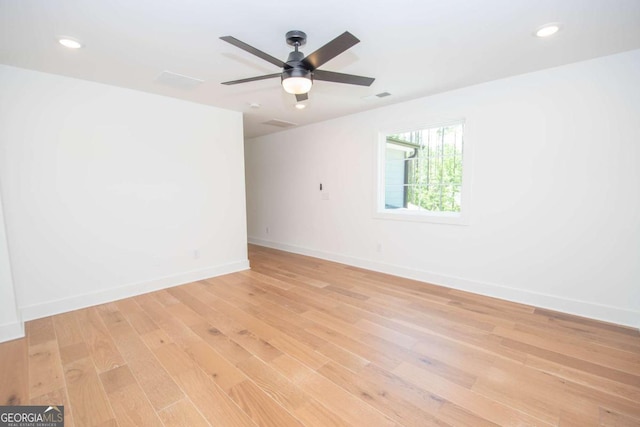 spare room featuring ceiling fan and light hardwood / wood-style floors