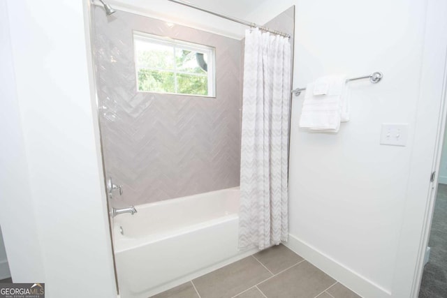 bathroom with tile patterned flooring and shower / bathtub combination with curtain