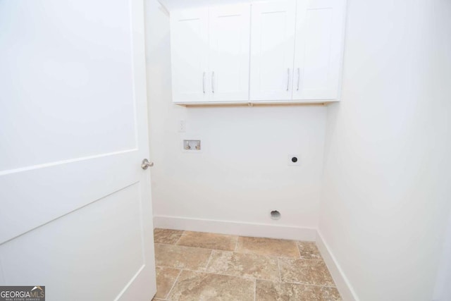 washroom featuring washer hookup, cabinets, and hookup for an electric dryer