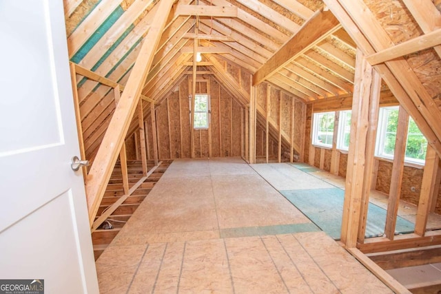 unfinished attic with a healthy amount of sunlight