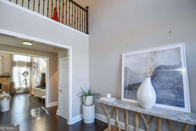 interior space with a fireplace and wood-type flooring