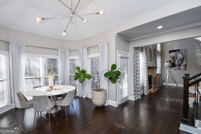 dining area featuring a notable chandelier and dark wood-type flooring