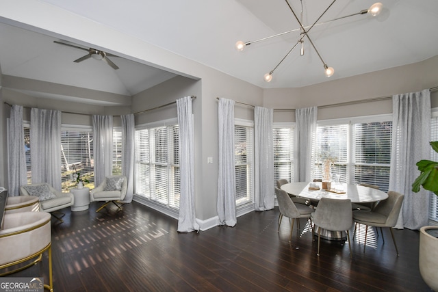 dining space with plenty of natural light, ceiling fan, dark wood-type flooring, and vaulted ceiling