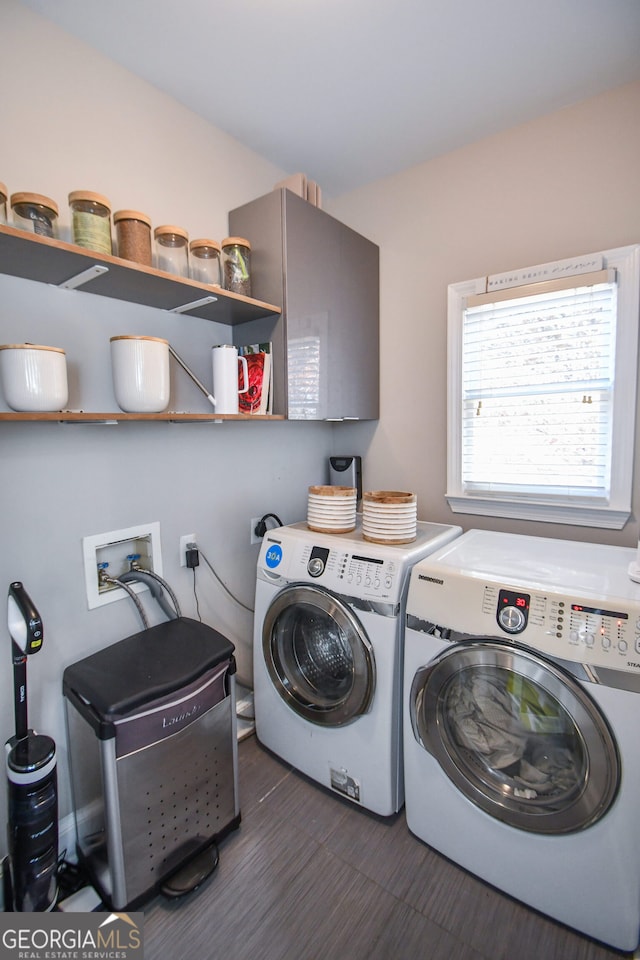 clothes washing area featuring washer and clothes dryer