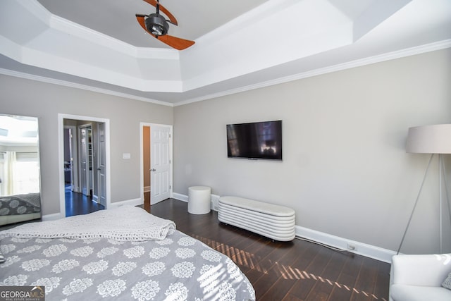 bedroom with ceiling fan, a raised ceiling, and ornamental molding