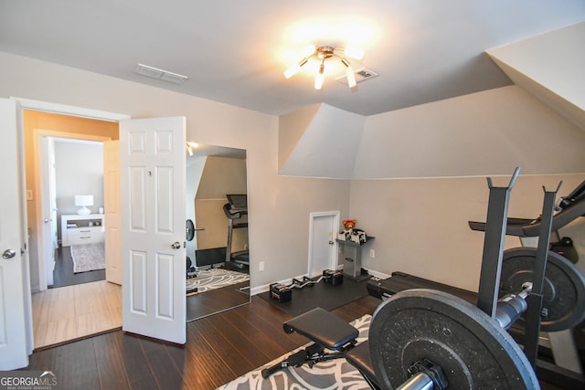 exercise room featuring dark wood-type flooring