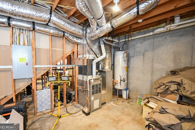 basement featuring electric panel and gas water heater