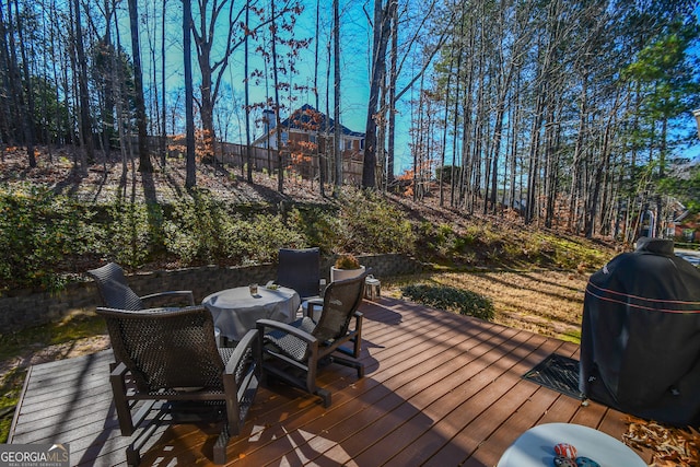 wooden deck featuring grilling area