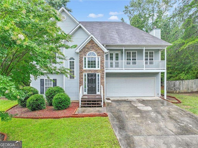 front of property with a garage and a front yard