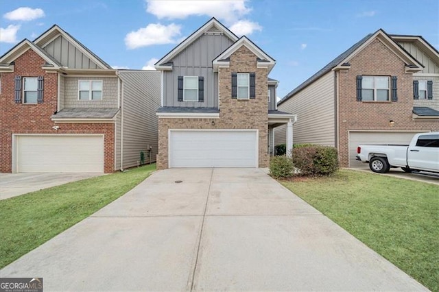 view of front of property with a front yard and a garage