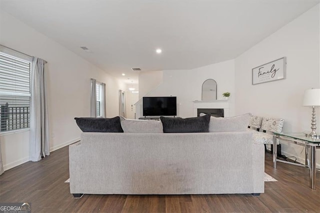 living room featuring dark wood-type flooring