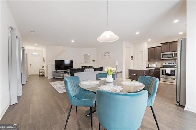 dining room with hardwood / wood-style flooring