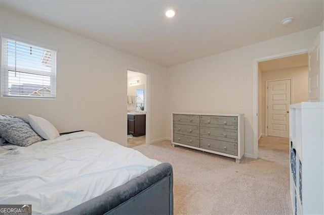 carpeted bedroom with ensuite bathroom