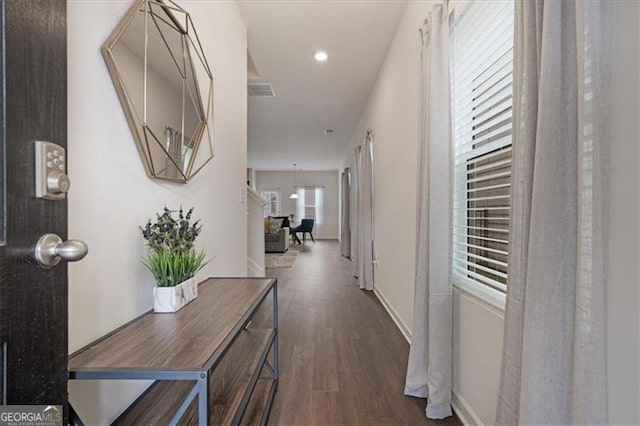 corridor with dark hardwood / wood-style floors