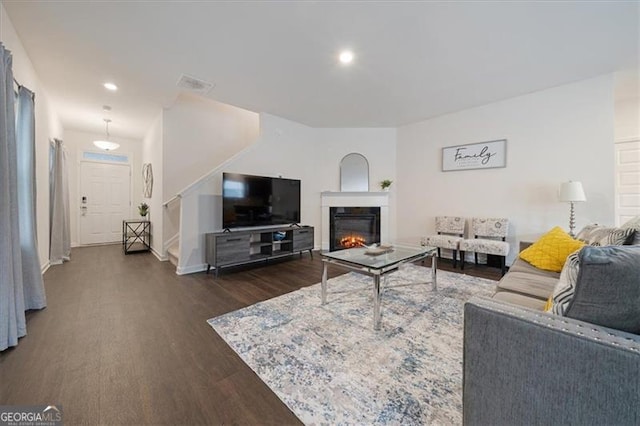 living room featuring dark wood-type flooring