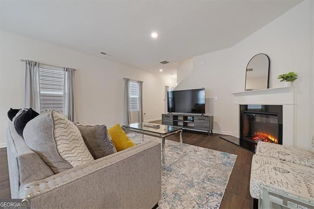 living room featuring dark wood-type flooring