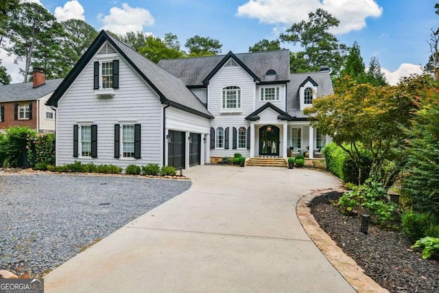 1409 Sheridan Rd NE, Atlanta, GA 30324 - view of front of house featuring driveway, a garage, and a shingled roof