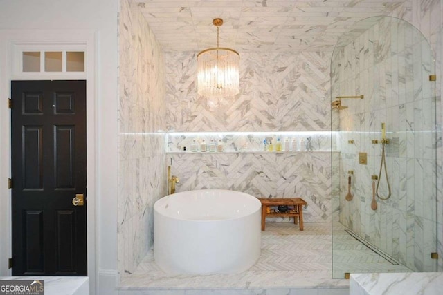 bathroom featuring plus walk in shower and a chandelier