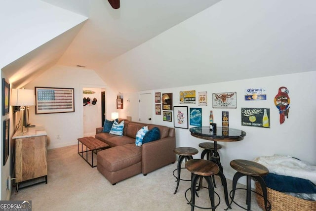 carpeted living room featuring lofted ceiling and ceiling fan