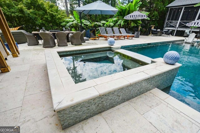 view of pool featuring a patio area