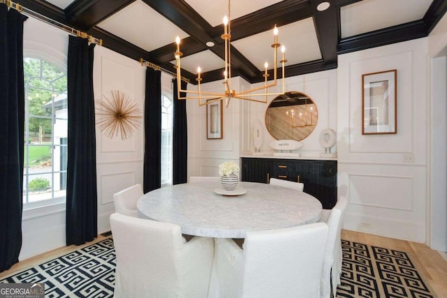 dining area featuring coffered ceiling and beamed ceiling