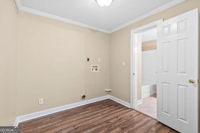 washroom with washer hookup, electric dryer hookup, crown molding, and dark wood-type flooring