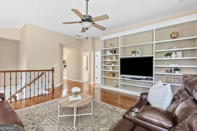 living room with hardwood / wood-style flooring and ceiling fan