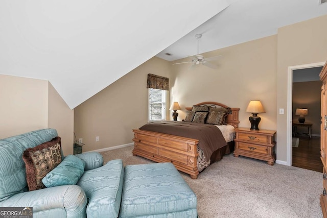 bedroom featuring ceiling fan, light carpet, and vaulted ceiling