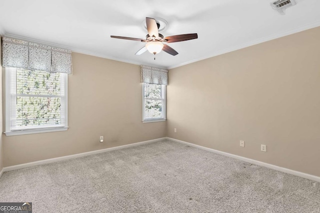 unfurnished room with carpet flooring, a healthy amount of sunlight, and ornamental molding